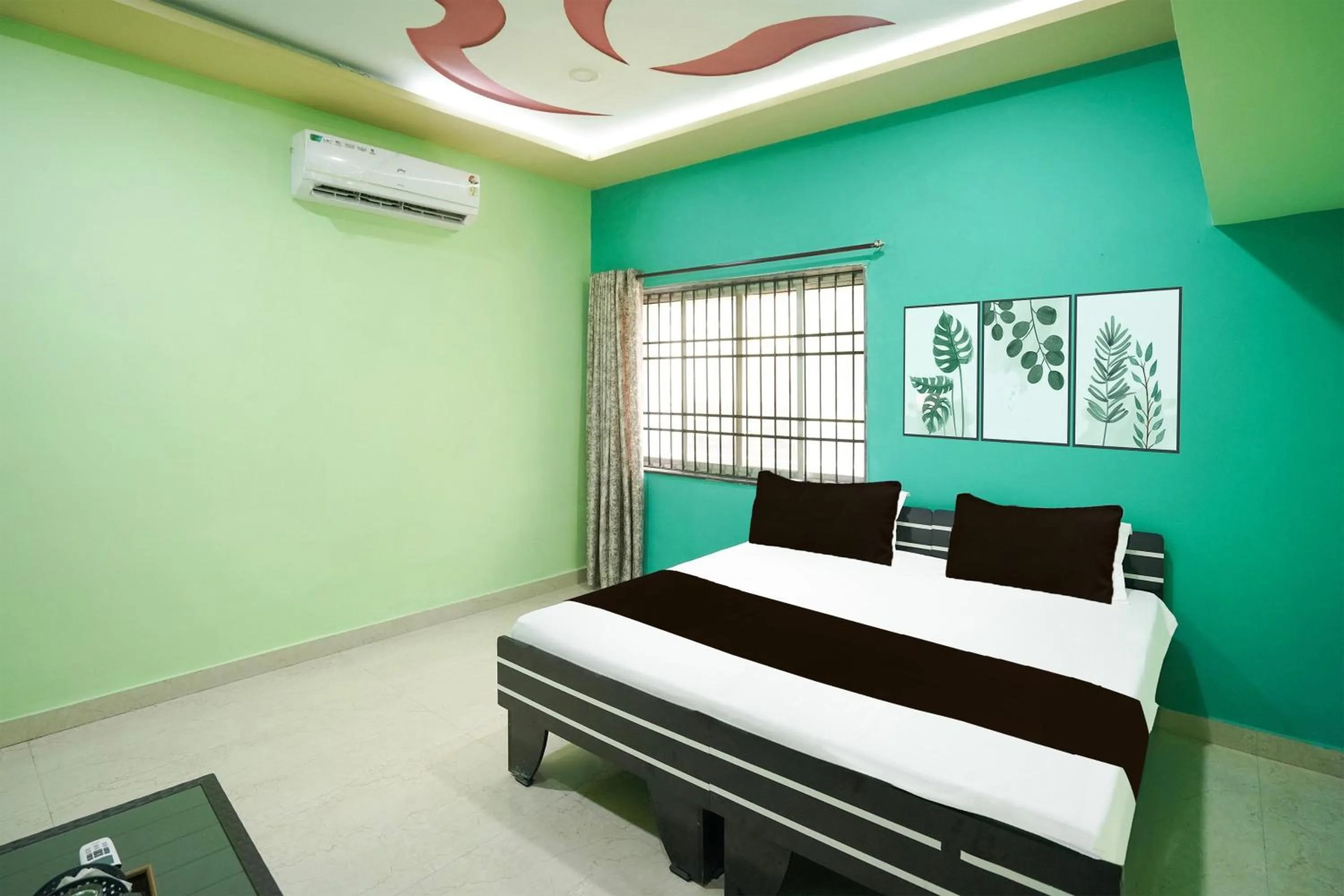 Bedroom in Hotel O Happy Hotel