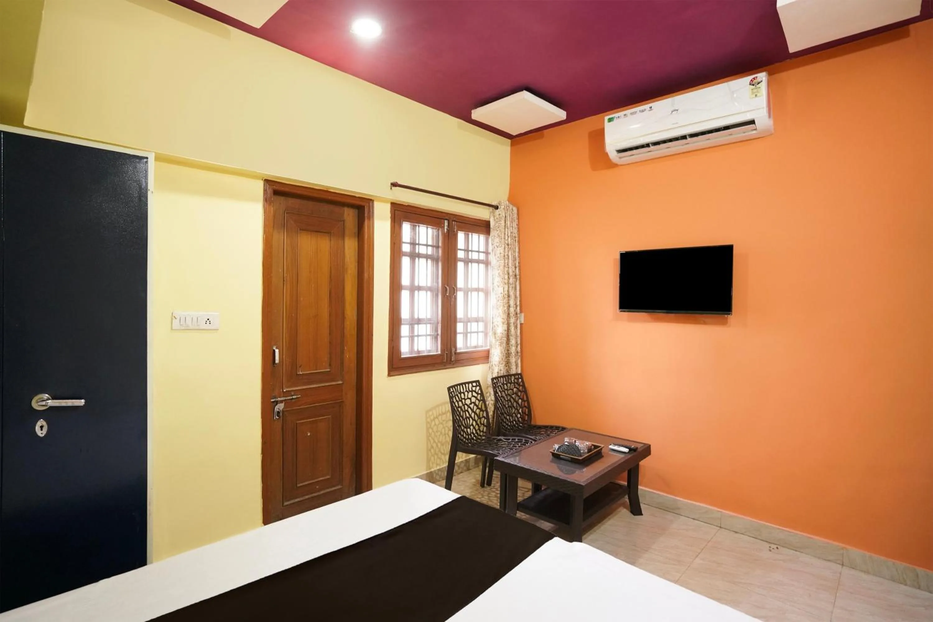 Bedroom in Hotel O Happy Hotel