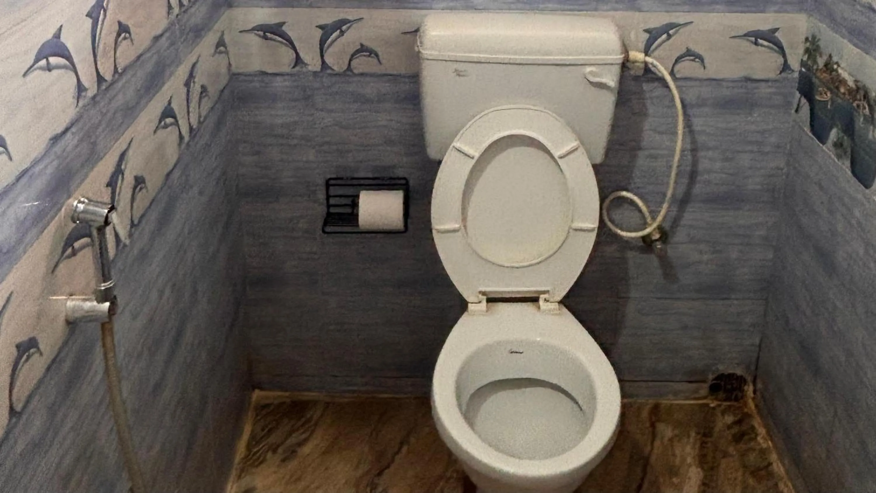 Toilet in Dee Dash Inn