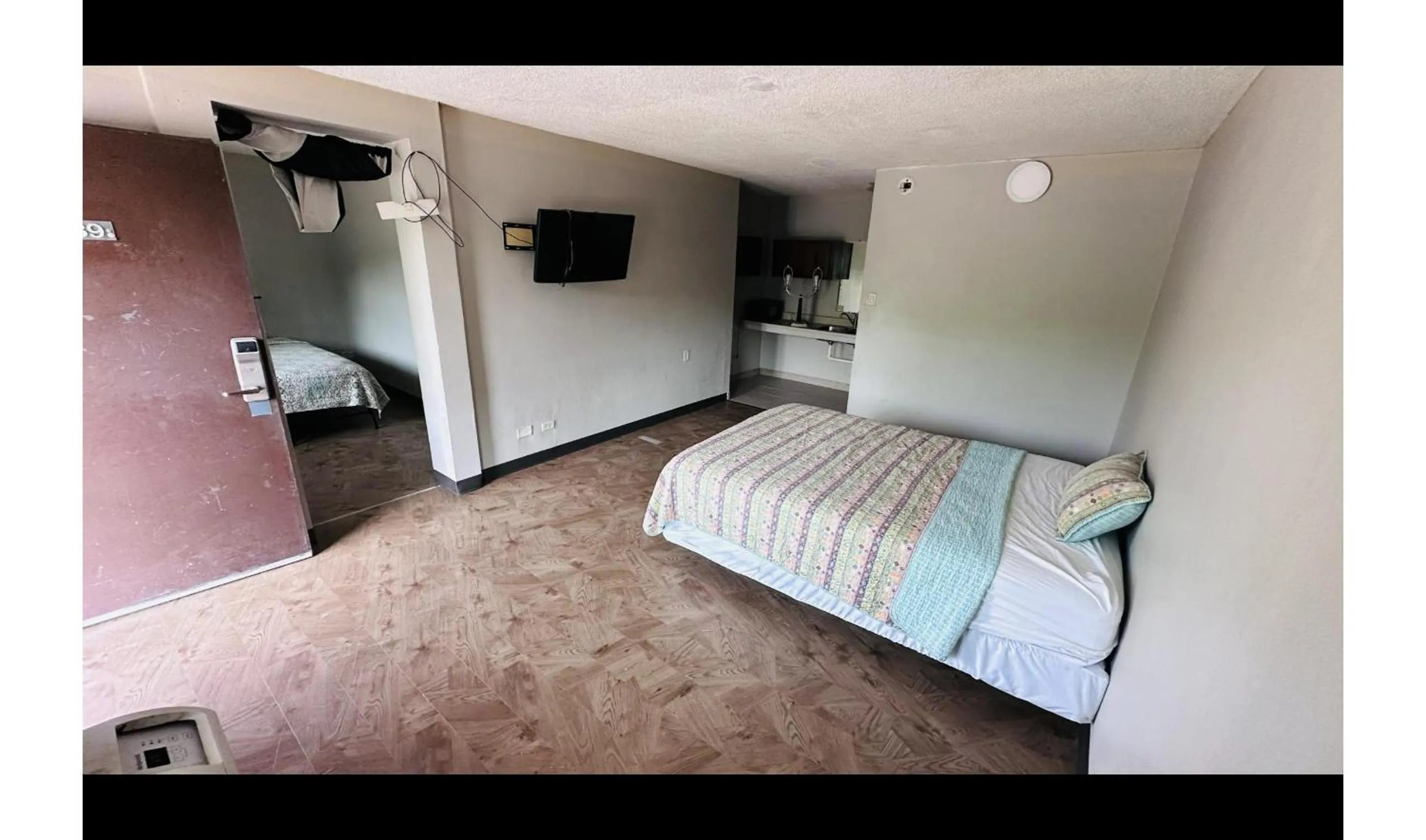 Bedroom in Hallmark Inn By OYO Fort Wayne