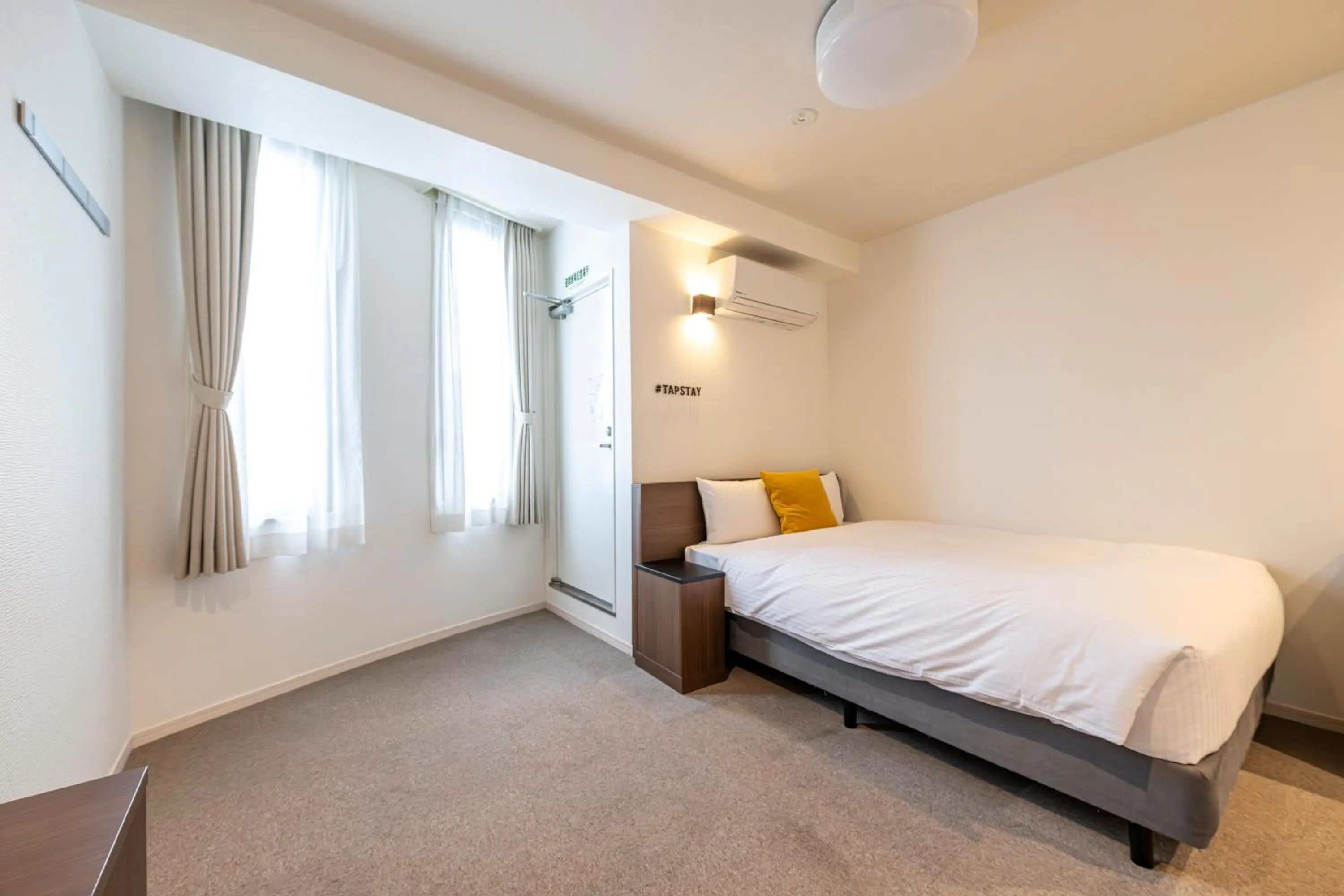 Bed in TapStay Hotel