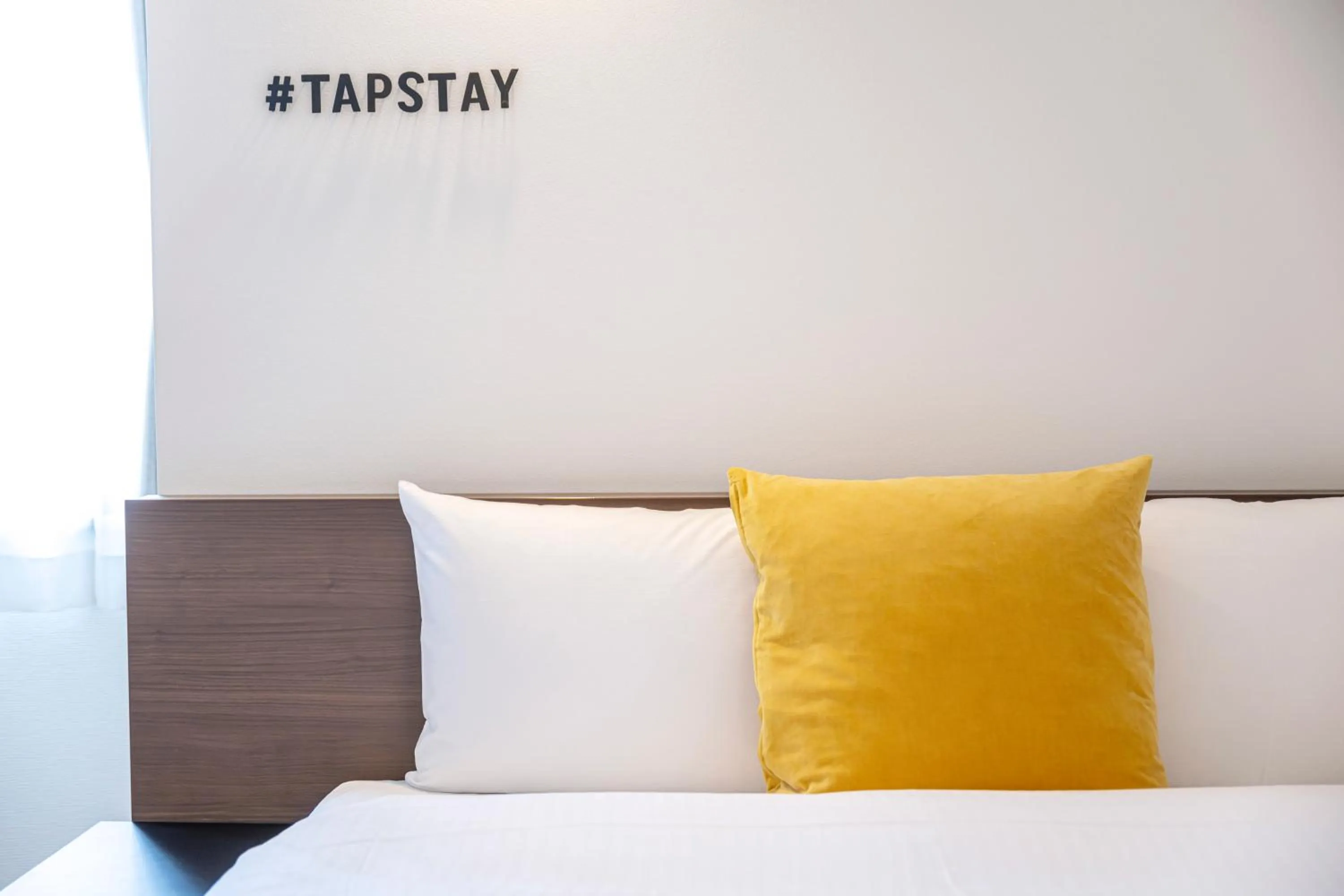 Bed in TapStay Hotel