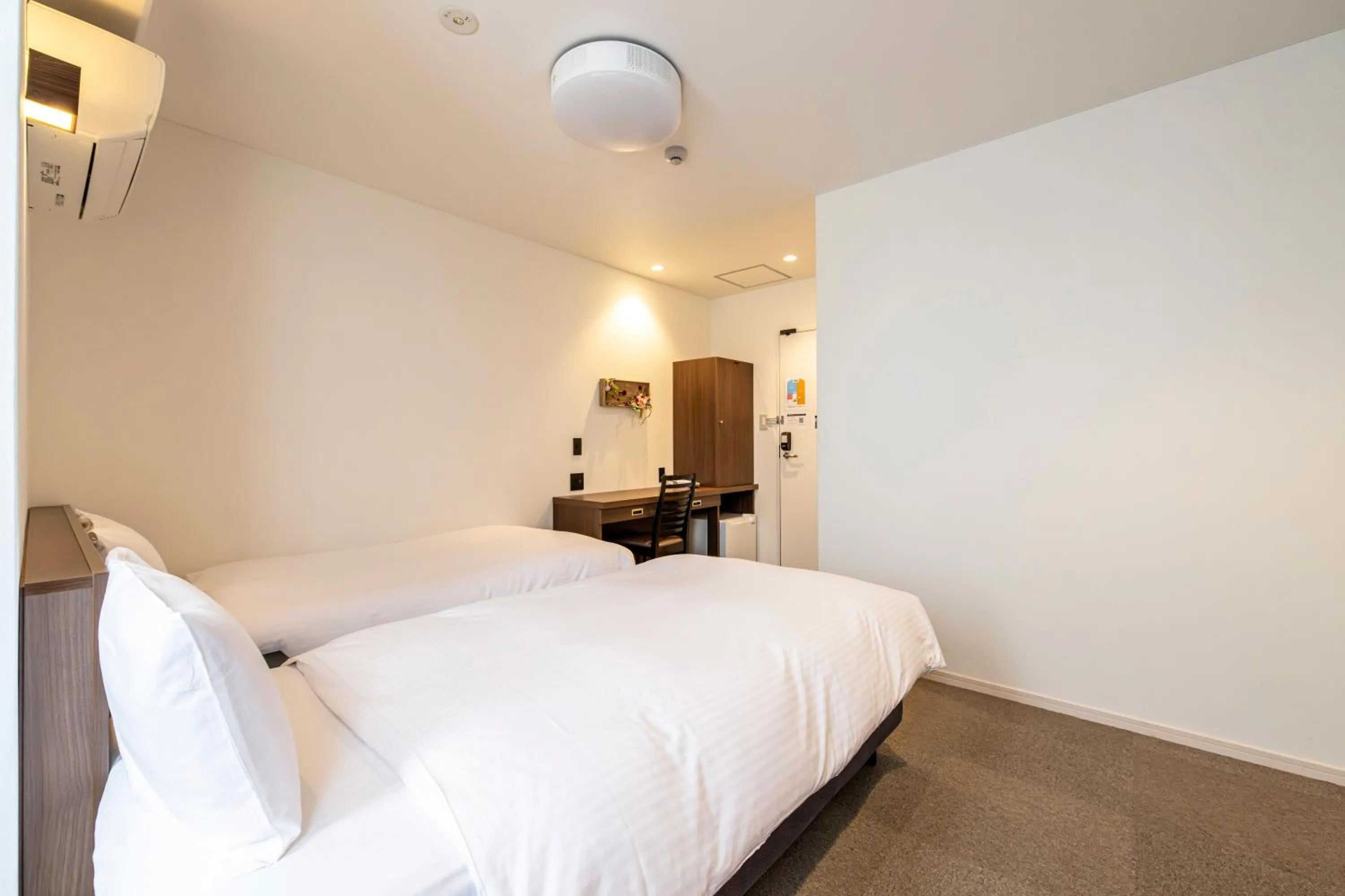 Bed in TapStay Hotel