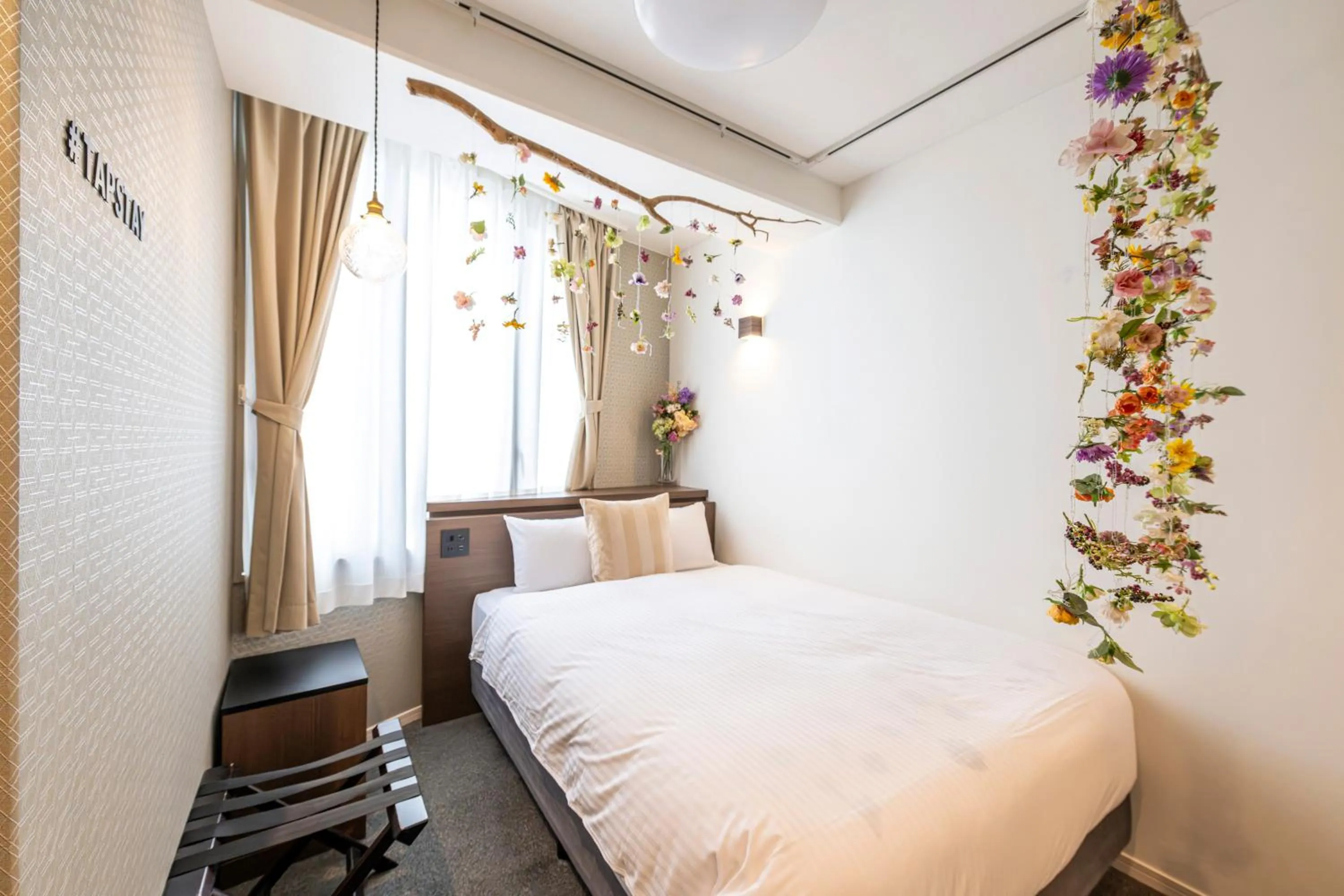 Bed in TapStay Hotel