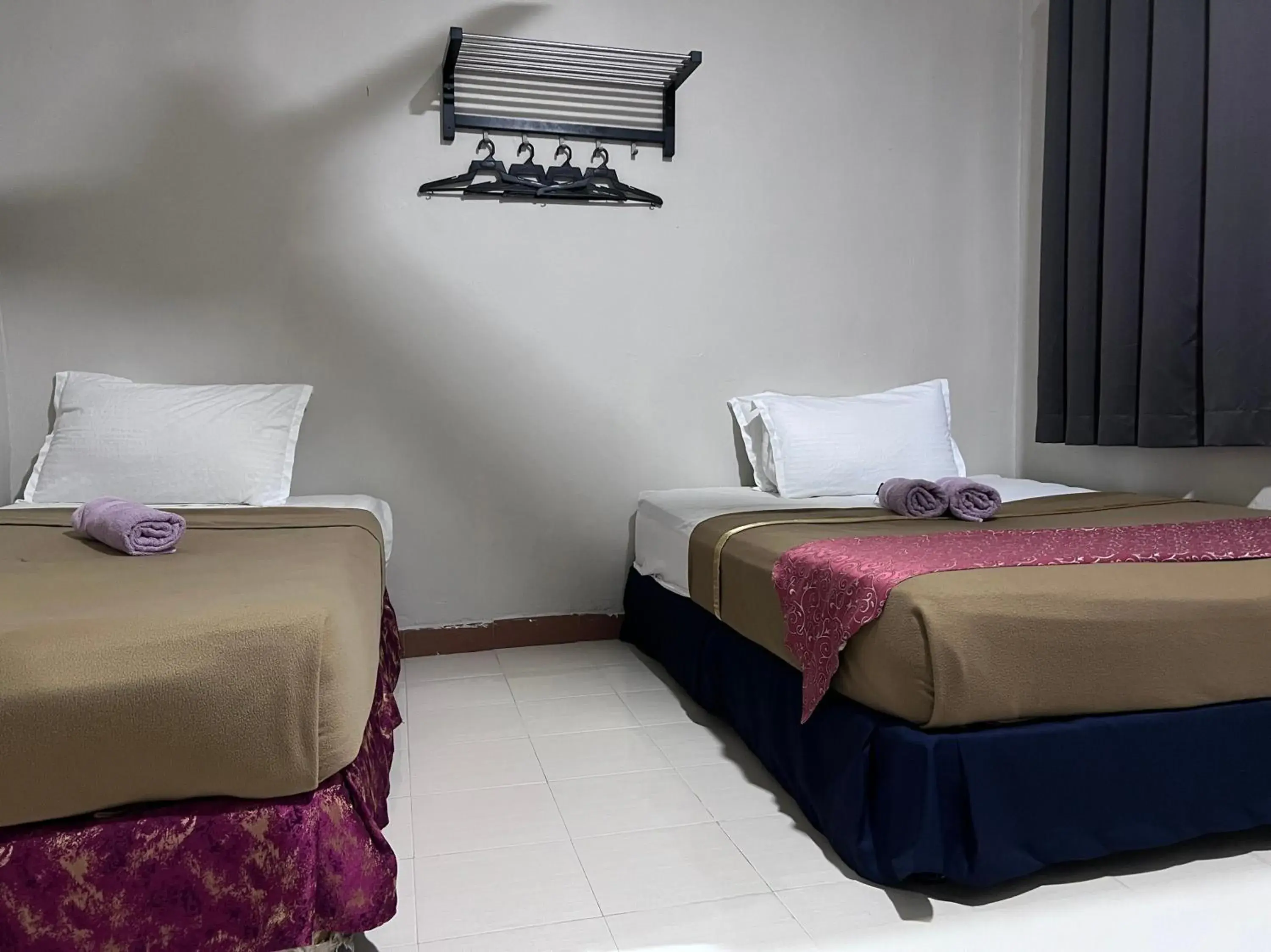 Deluxe Triple Room in Capital O 91017 Tuba Beach Resort @ Pulau Tuba Deluxe Triple Room in Capital O 91017 Tuba Beach Resort @ Pulau Tuba