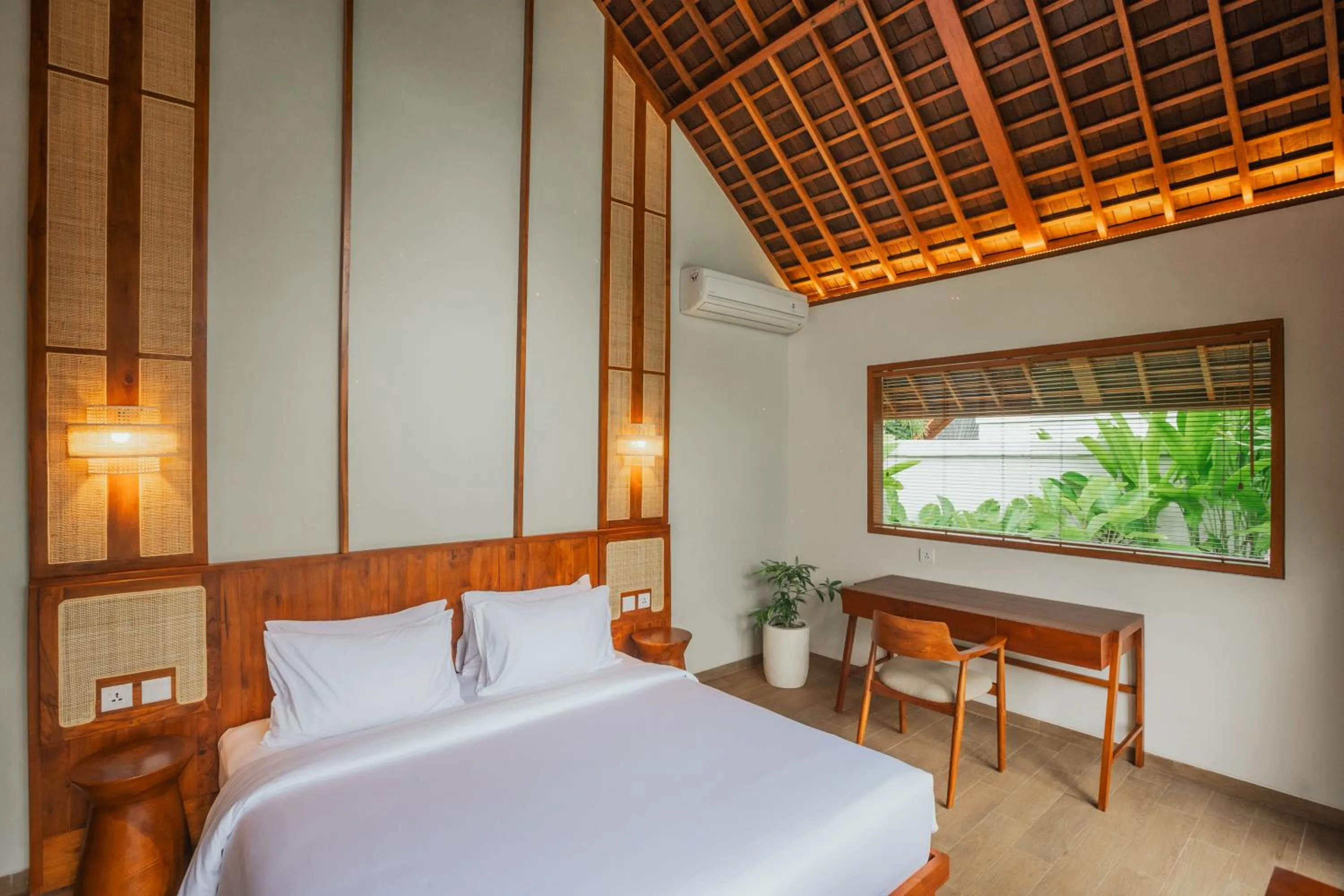 Bed in Arpana Luxury Private Pool Villas