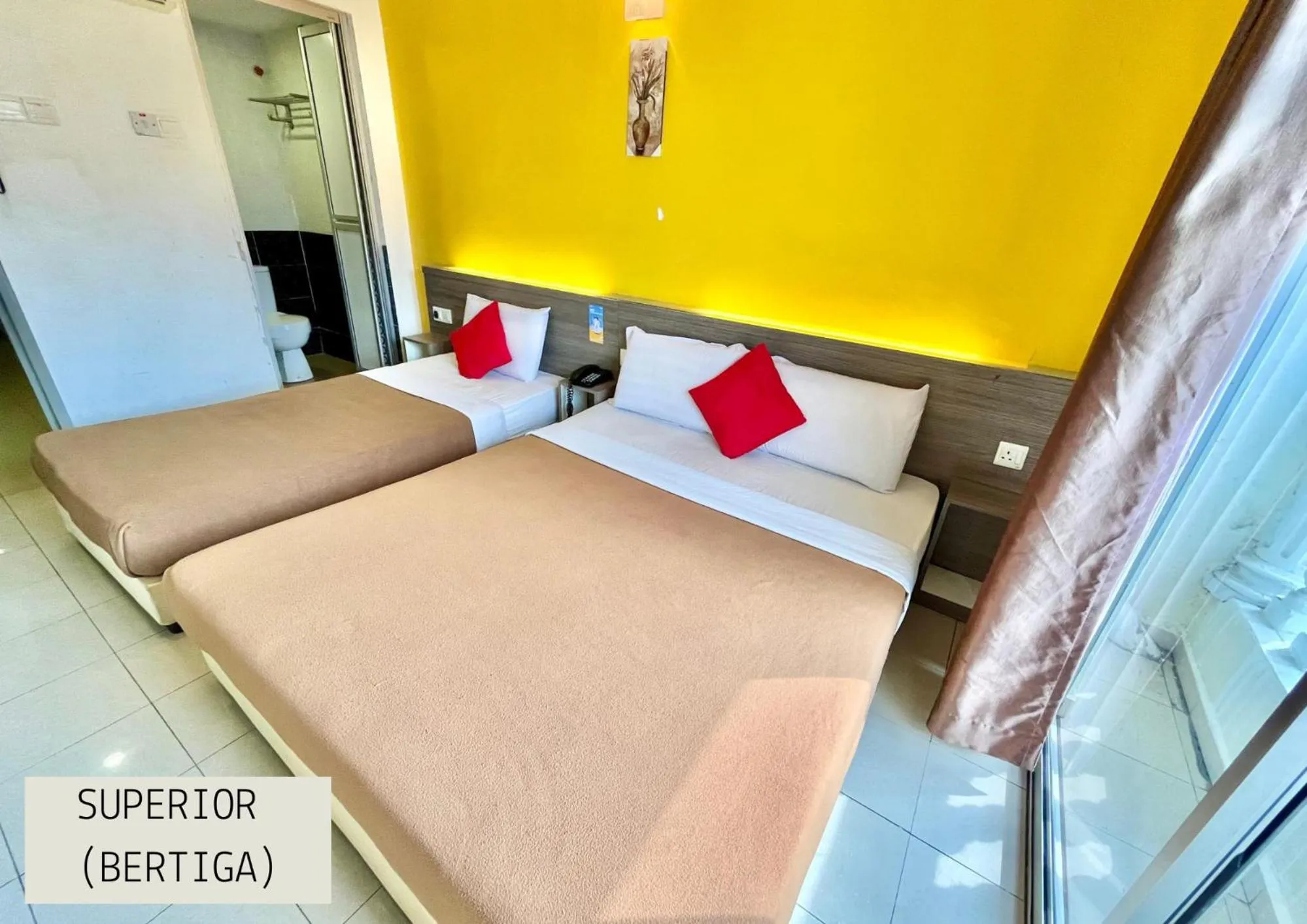 Bed in Yellow Mansion Hotel Melaka Raya