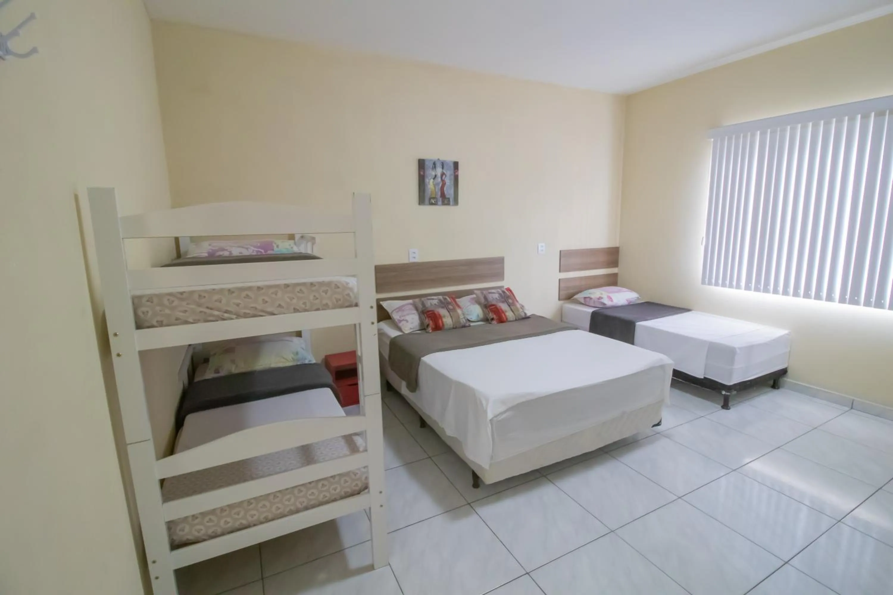 Bed in Pousada Vovó Dilma