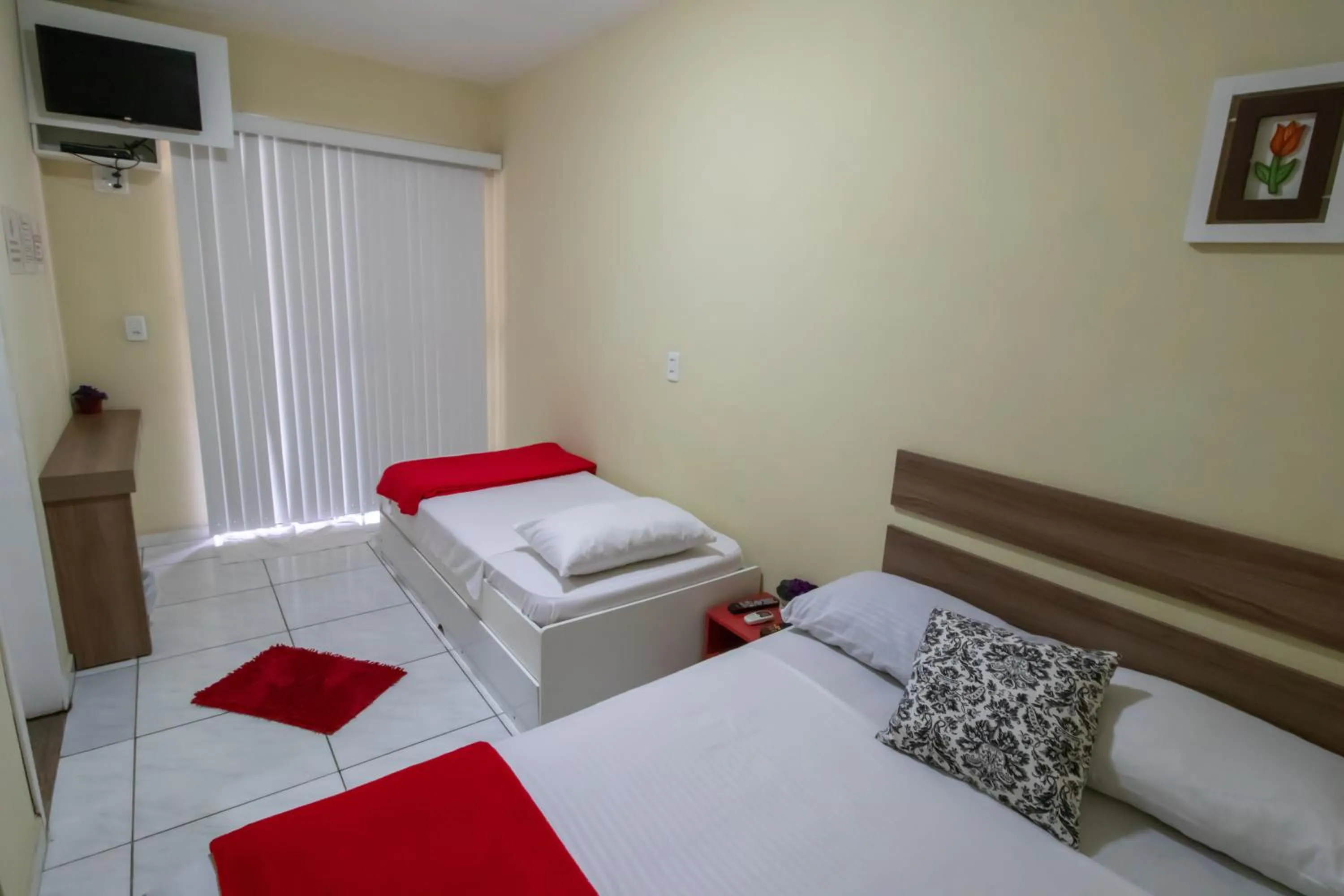 Bed in Pousada Vovó Dilma