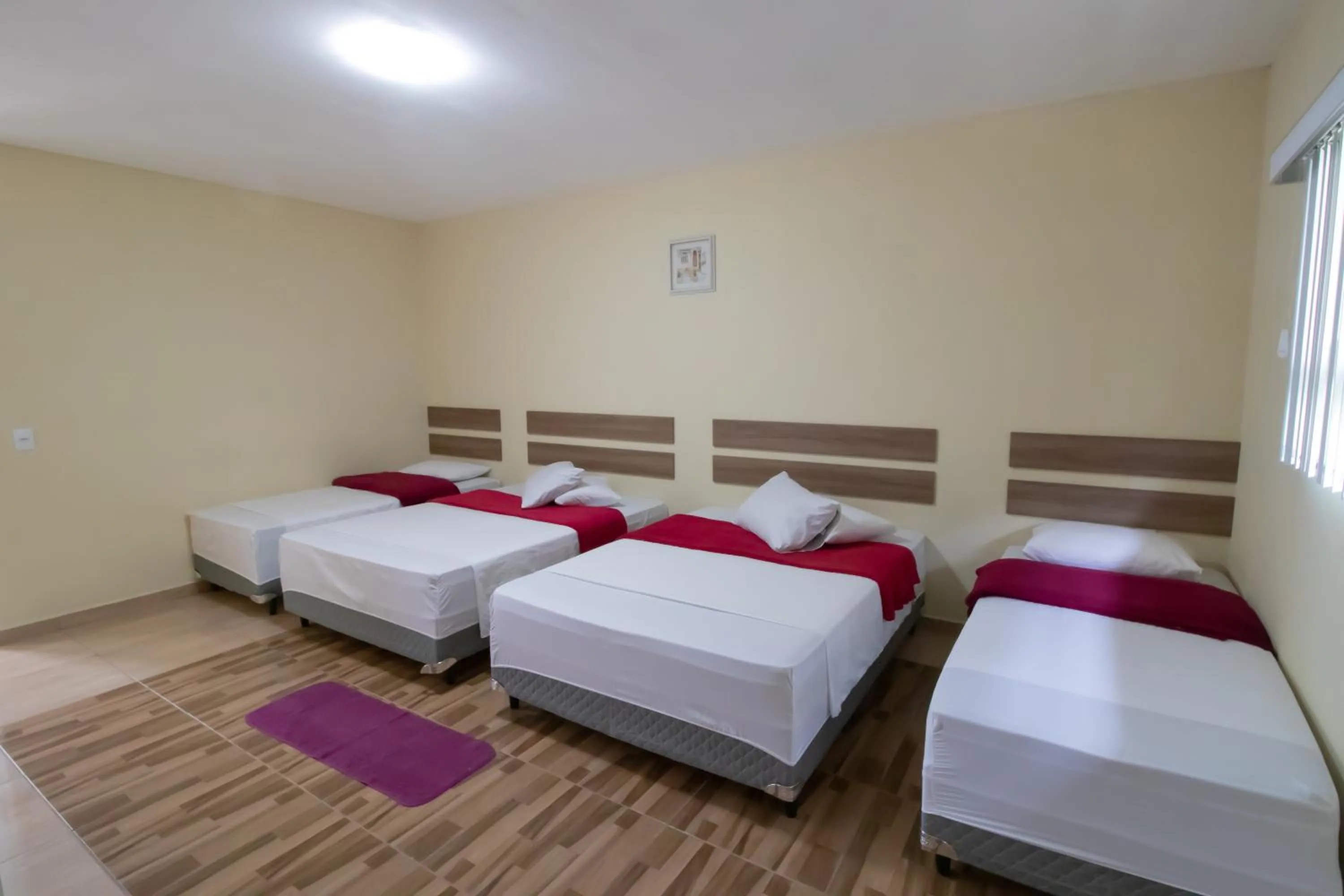 Bed in Pousada Vovó Dilma