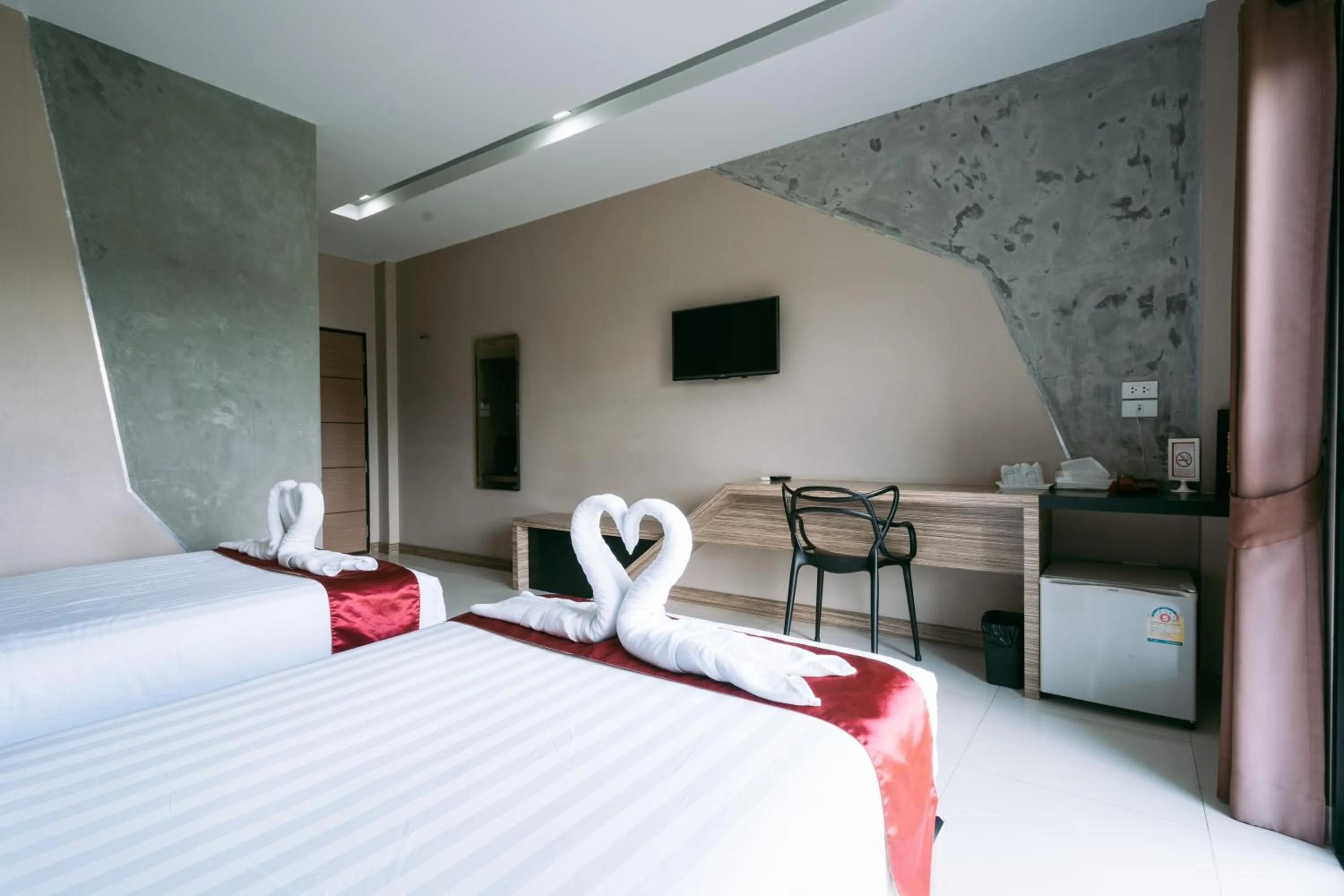 Bed in Ray Hotel Buriram