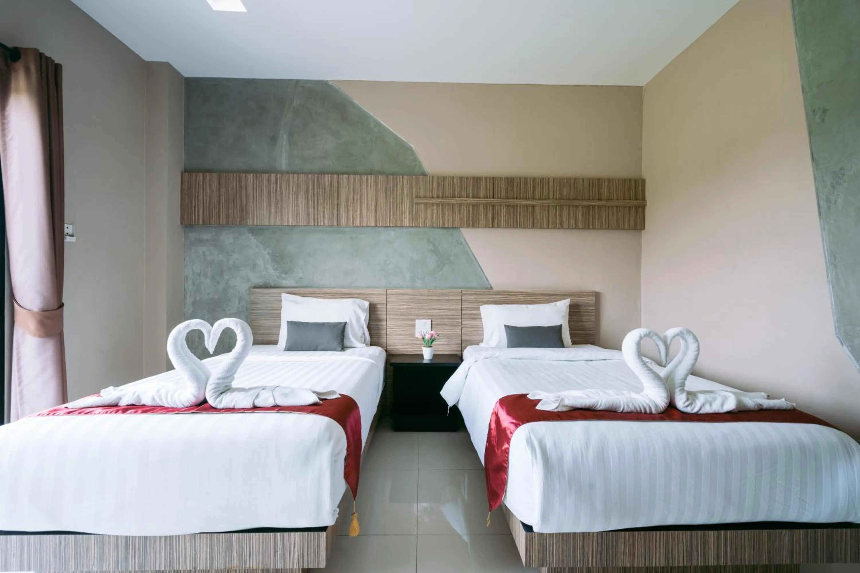 Bed in Ray Hotel Buriram