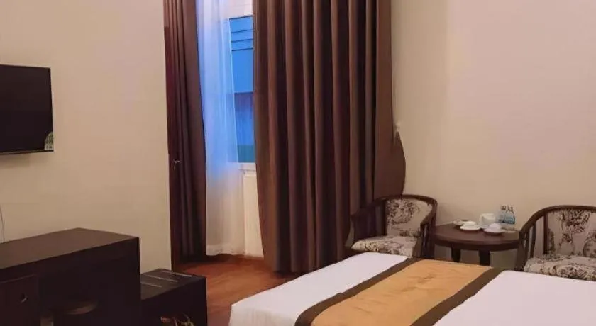 Bed in LUCKY STAR HOTEL