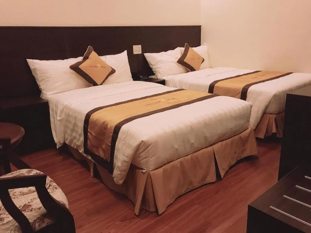 Bed in LUCKY STAR HOTEL