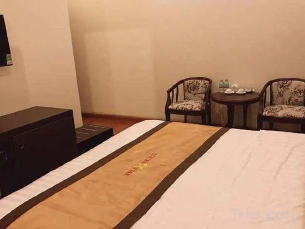 Bed in LUCKY STAR HOTEL