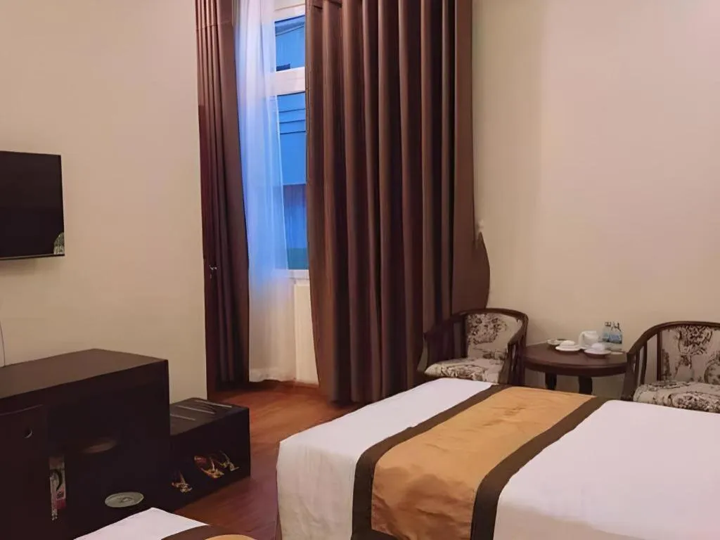 Bed in LUCKY STAR HOTEL