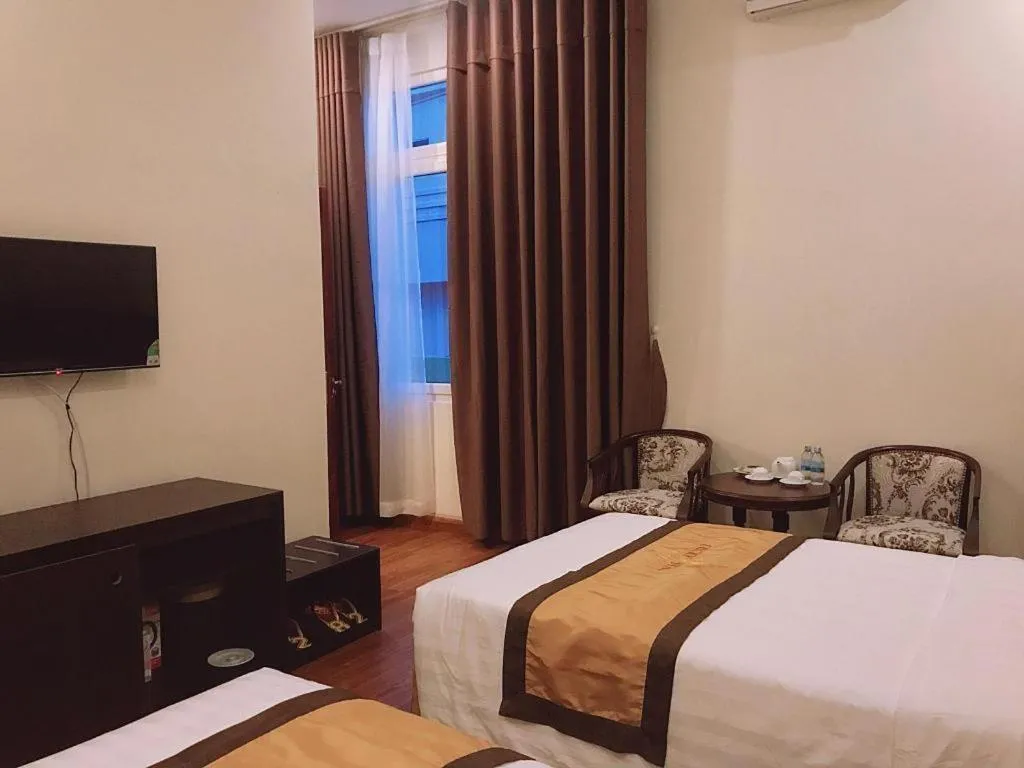 Bed in LUCKY STAR HOTEL