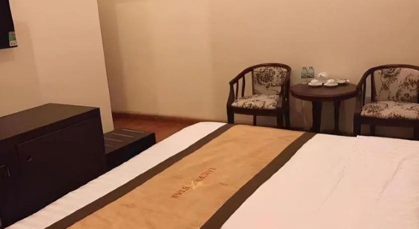 Bed in LUCKY STAR HOTEL