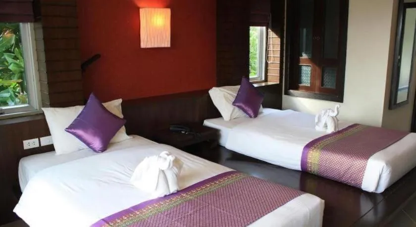 Bed in Wild Orchid Villa Krabi