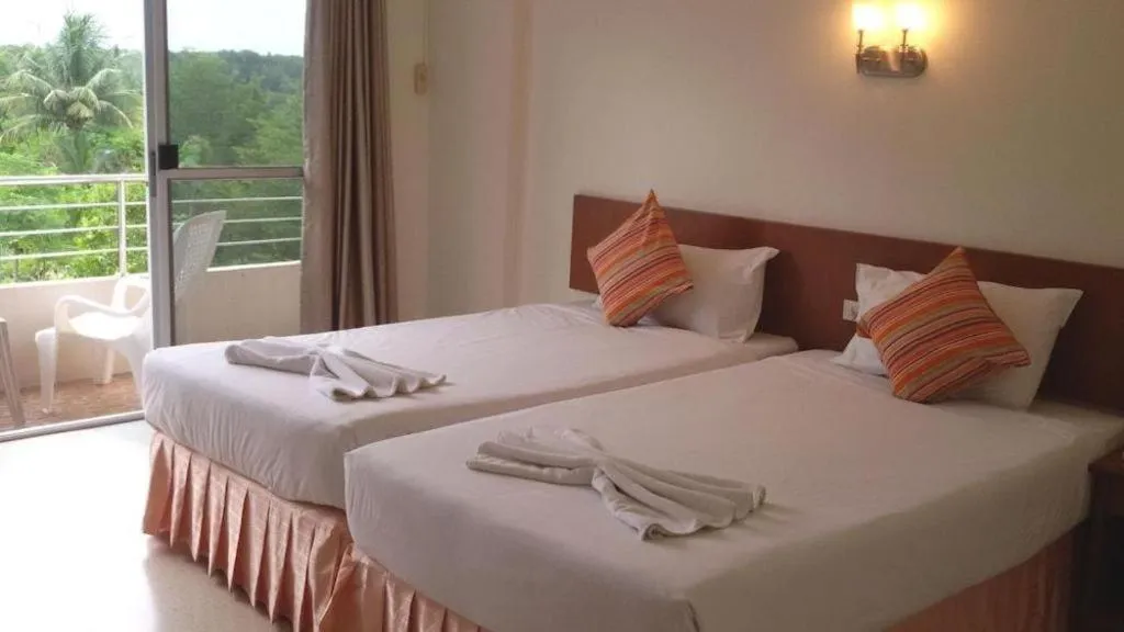 Bed in Wild Orchid Villa Krabi
