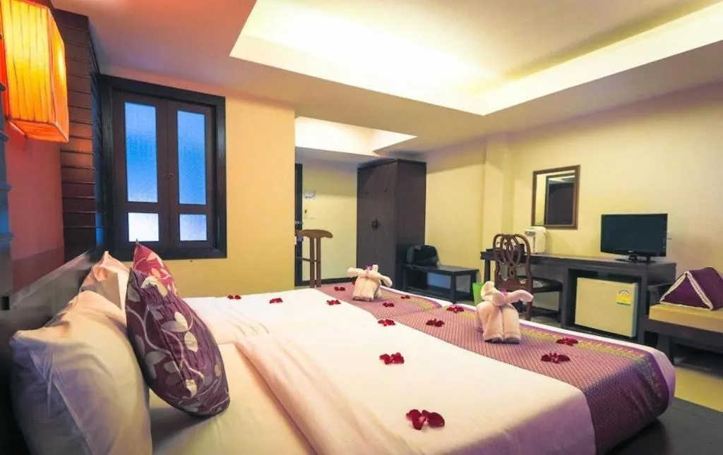 Bed in Wild Orchid Villa Krabi