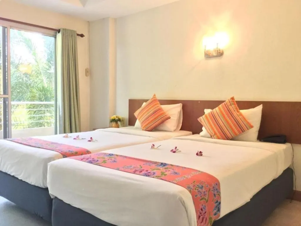Bed in Wild Orchid Villa Krabi