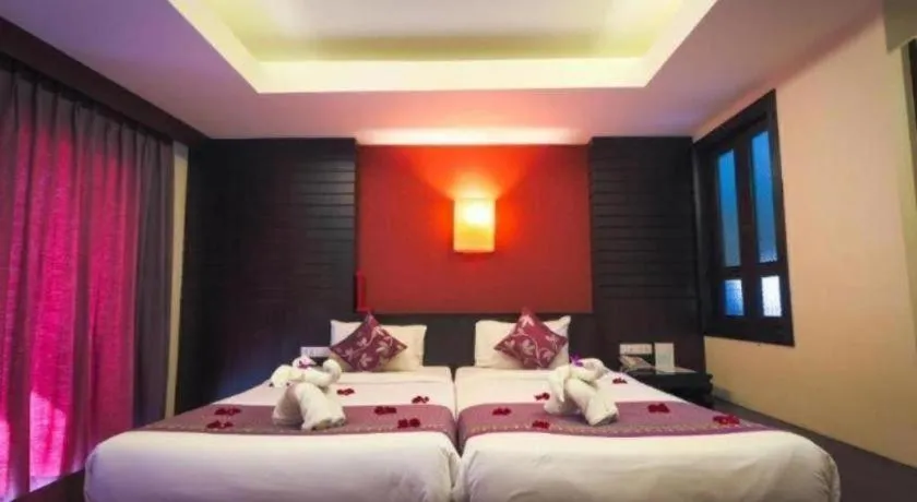 Bed in Wild Orchid Villa Krabi