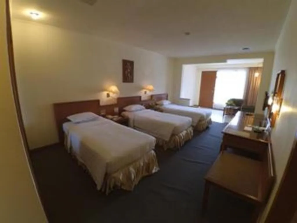 Bed in Purnama Hotel