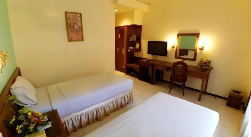 Bed in Purnama Hotel