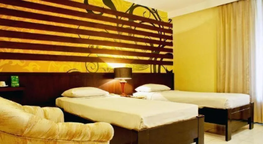 Bed in Purnama Hotel