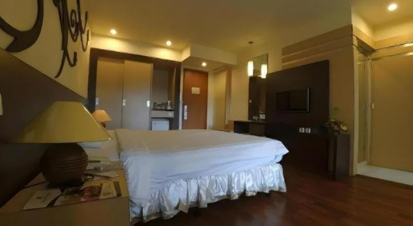 Bed in Purnama Hotel