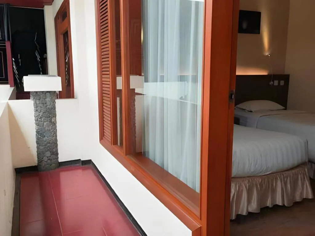 Bed in Purnama Hotel