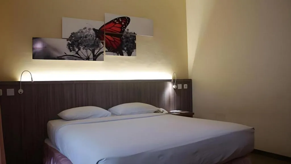 Bed in Purnama Hotel