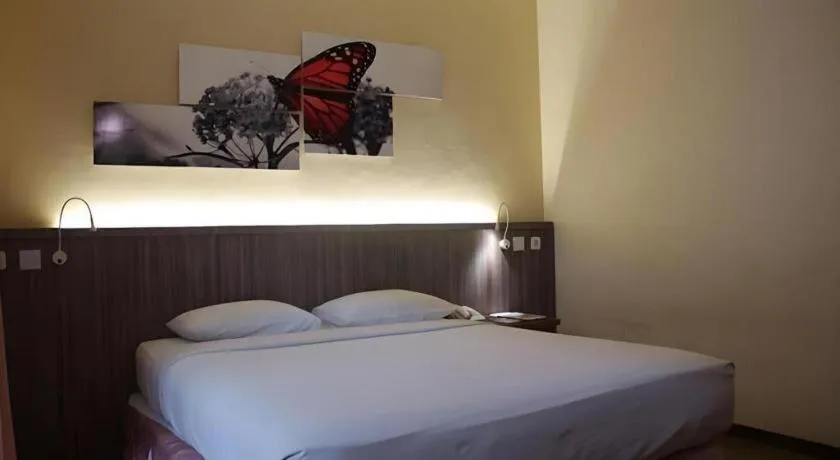 Bed in Purnama Hotel
