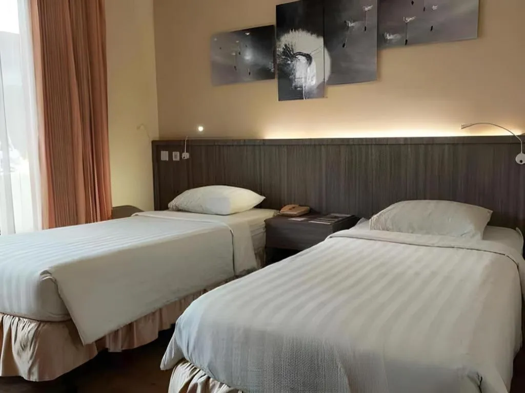 Bed in Purnama Hotel