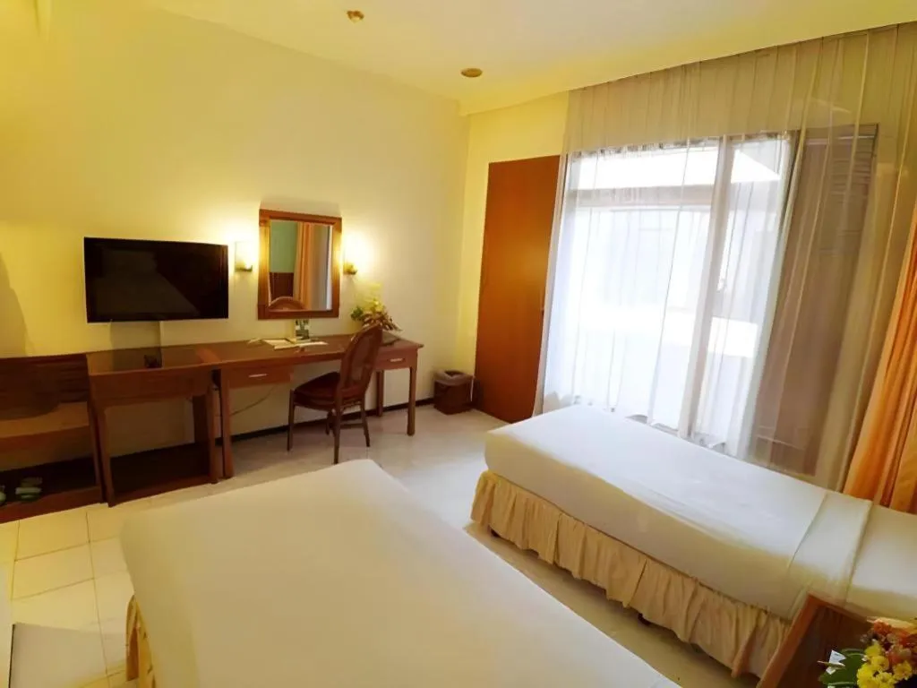 Bed in Purnama Hotel