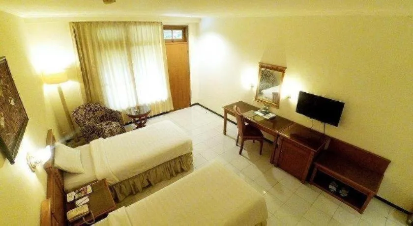 Bed in Purnama Hotel