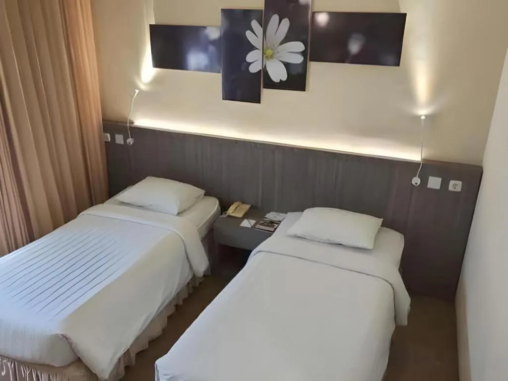 Bed in Purnama Hotel