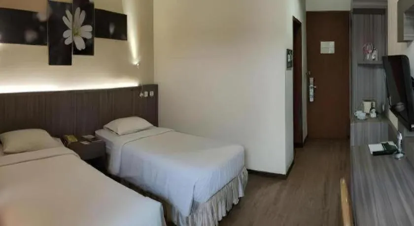 Bed in Purnama Hotel