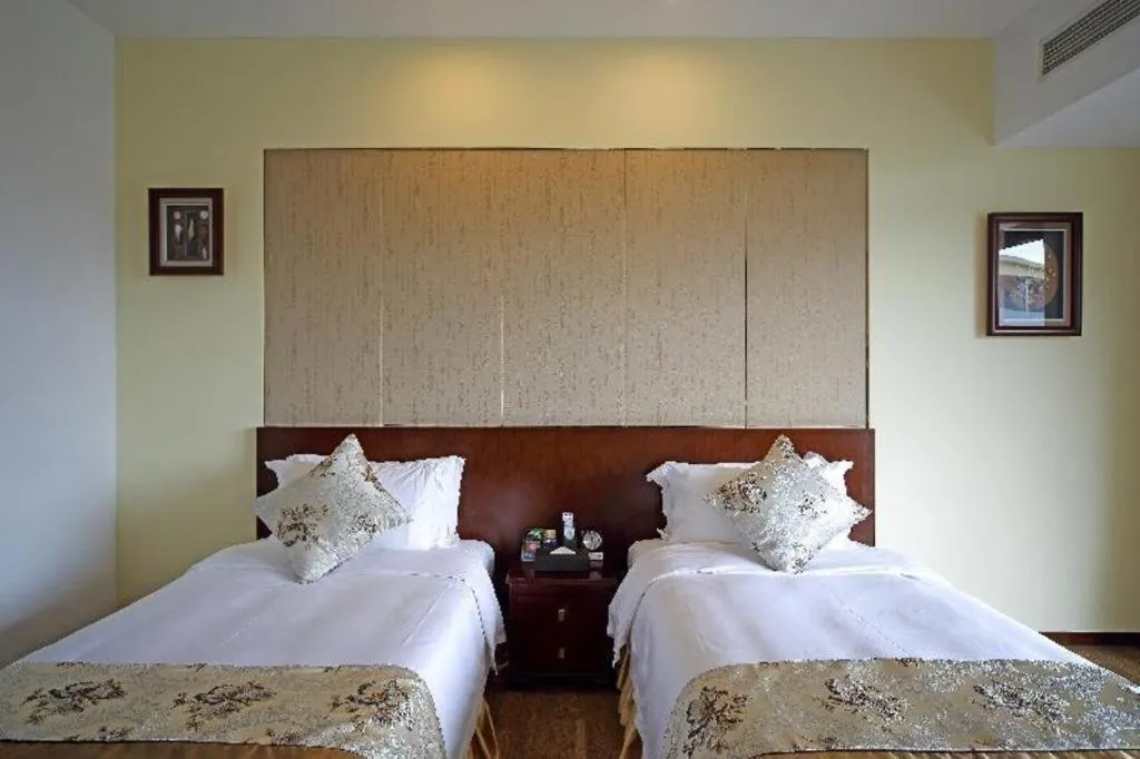 Bed in Serenity Marina Hotel