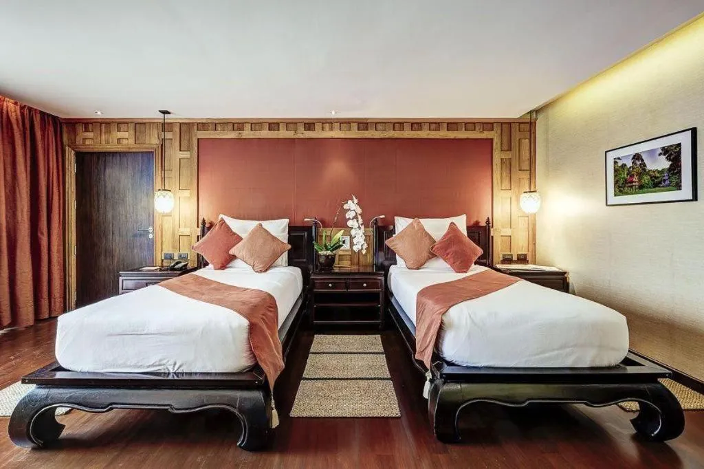 Bed in Baan Souchada Resort & Spa