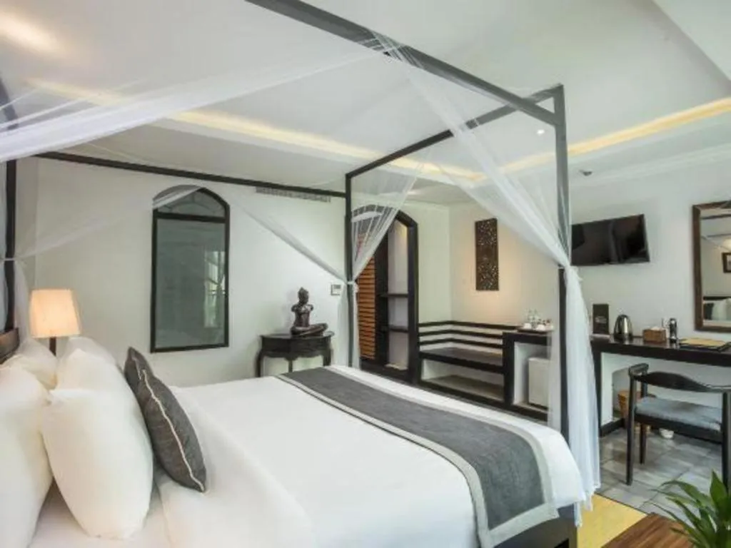 Bed in The Grand Cyclo Boutique Suite & Spa