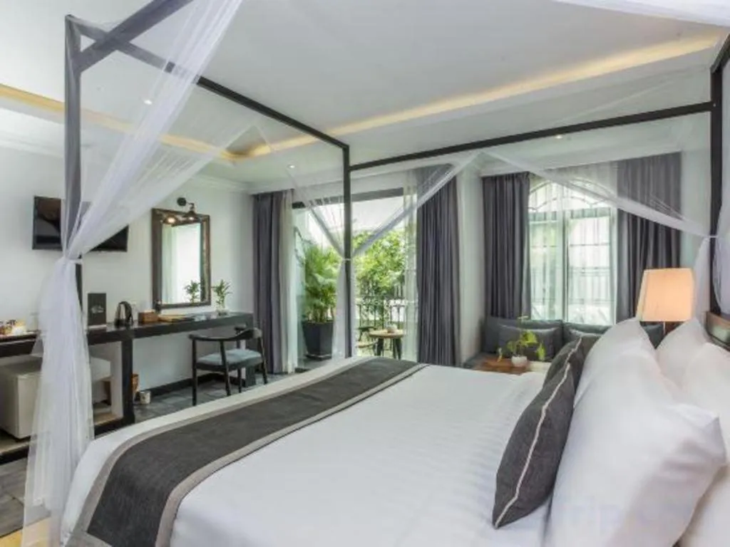 Bed in The Grand Cyclo Boutique Suite & Spa