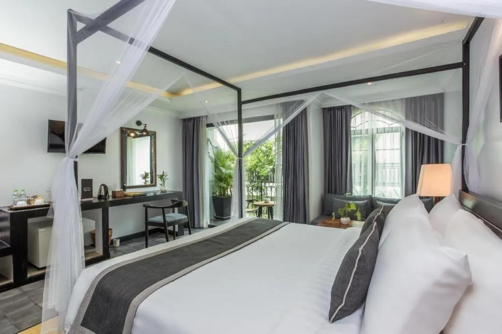 Bed in The Grand Cyclo Boutique Suite & Spa