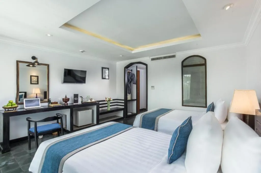 Bed in The Grand Cyclo Boutique Suite & Spa