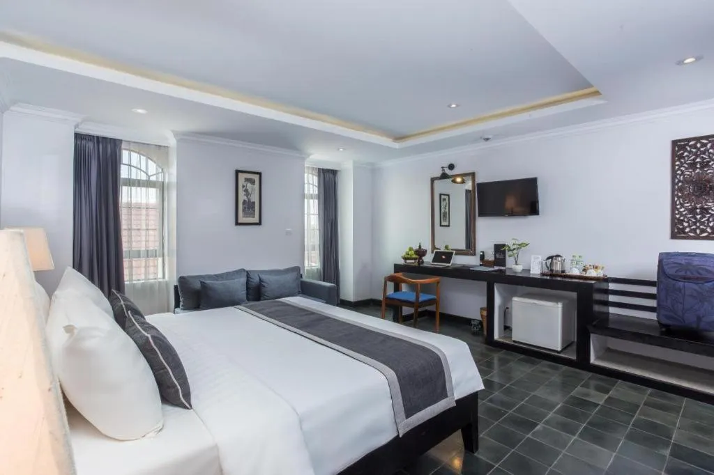 Bed in The Grand Cyclo Boutique Suite & Spa