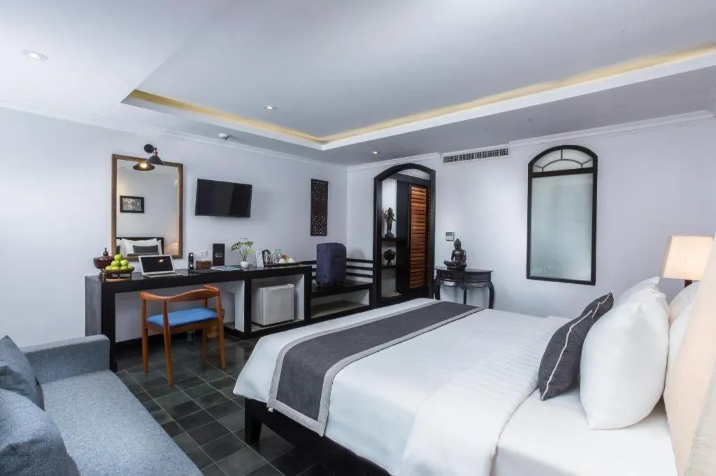 Bed in The Grand Cyclo Boutique Suite & Spa