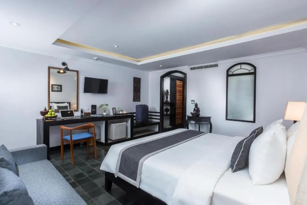 Bed in The Grand Cyclo Boutique Suite & Spa