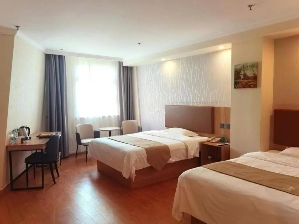 Bed in GreenTree Inn Kunshan Shimao Plaza Business Hotel