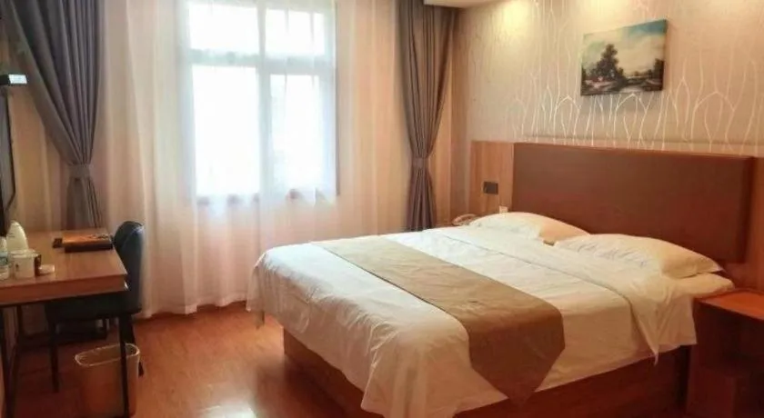 Bed in GreenTree Inn Kunshan Shimao Plaza Business Hotel